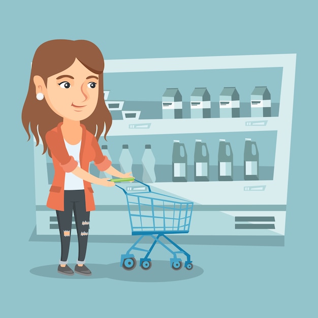 Young caucasian woman with a supermarket trolley.