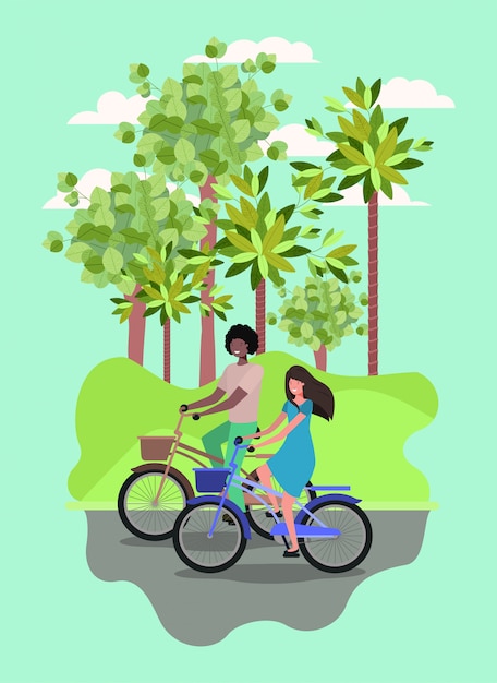 Young couple on bicycle in the park