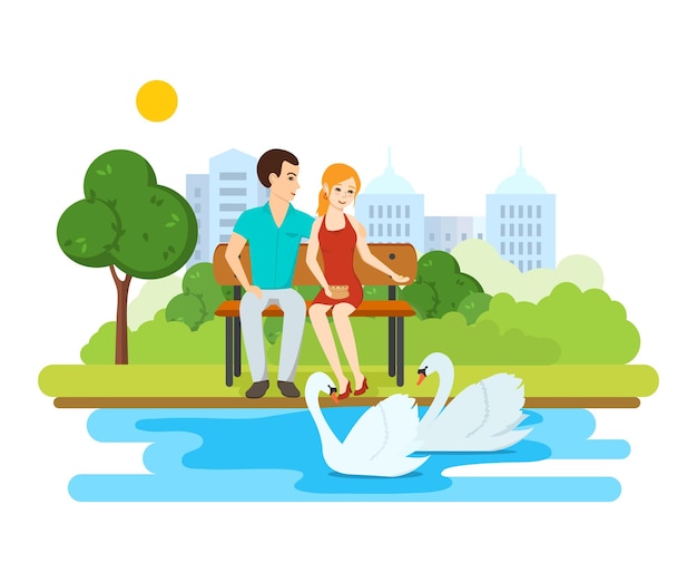 Young couple relax on bench park near lake with swans