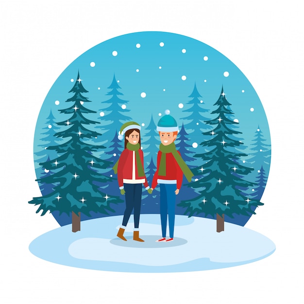 Young couple with winter clothes in snowscape