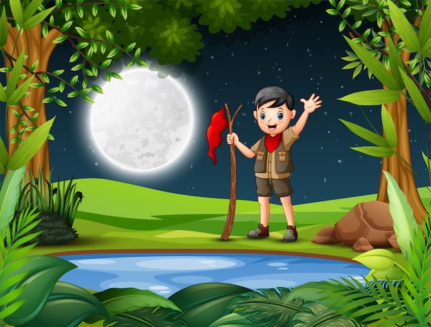 Young explorer in the forest at night