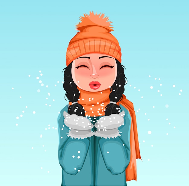 Young girl in winter clothes playing with snow