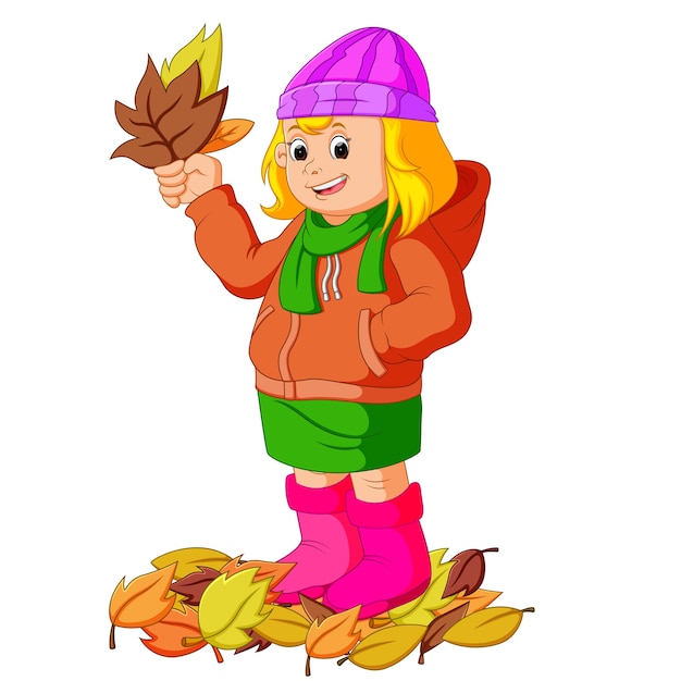 Young girl with autumn leaf