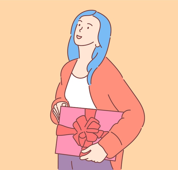 Young happy cheerful smiling excited womag girl holding carrying present