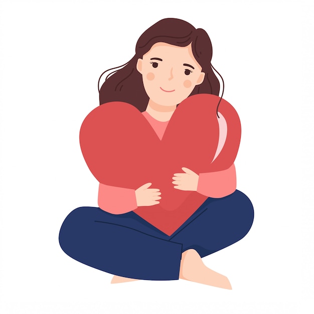 Young lady hugging big heart shape