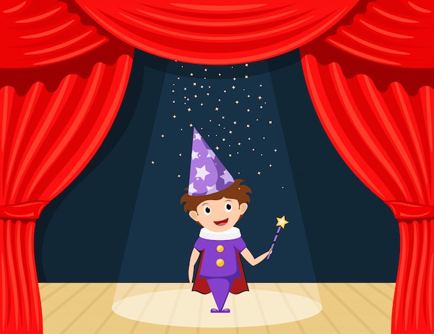 young magician on stage. children's performance. small actor on stage playing the role of a wizard.