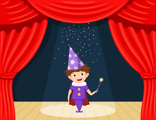 Young magician on stage. Children's performance. Small actor on stage playing the role of a wizard.