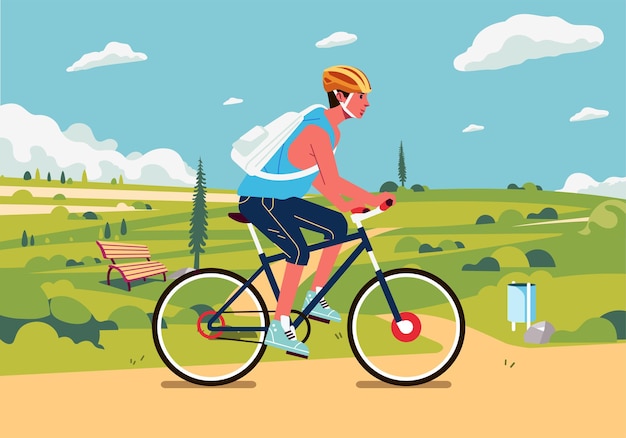 Молодой человек на велосипеде в пригороде с красивым зеленым пейзажем на заднем плане