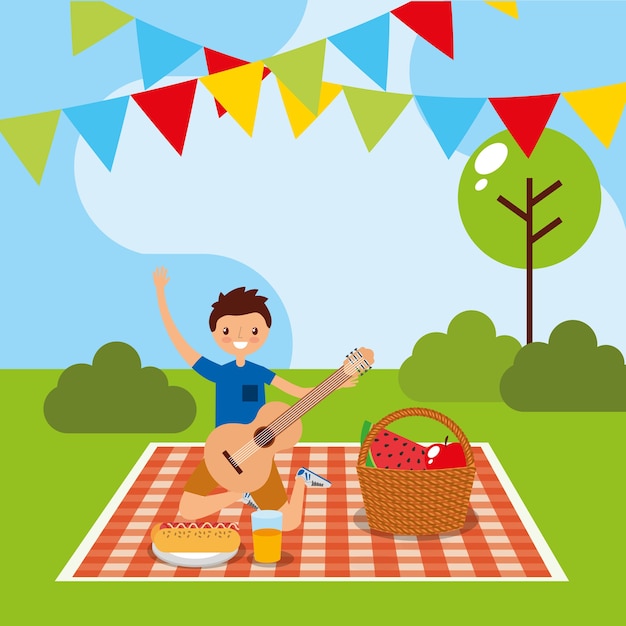 Young man having picnic in the park