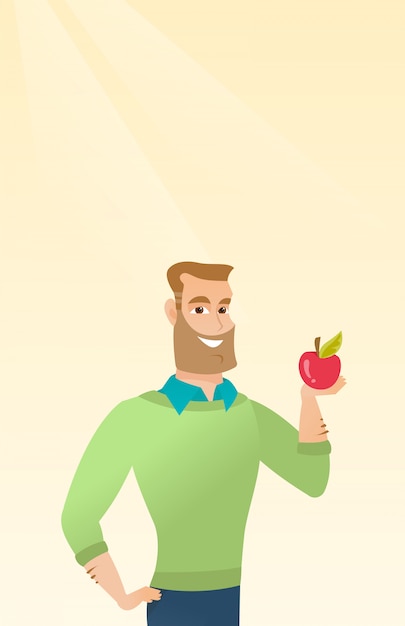 Young man holding an apple 