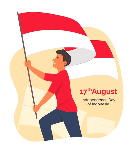 8月17日にインドネシア独立記念日のお祝いのためのインドネシアの旗を保持している若い男
