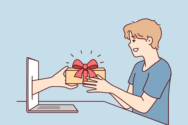 Молодой человек получает подарок из руки, высунутой из экрана ноутбука после покупок в Интернете Векторное изображение