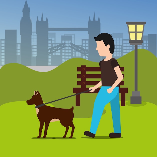 Young man walking with her dog in the park