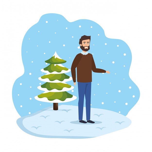 Young man with christmas sweater in snowscape