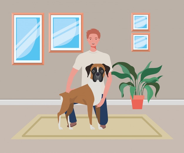 Молодой человек с милой собакой талисман в комнате дома