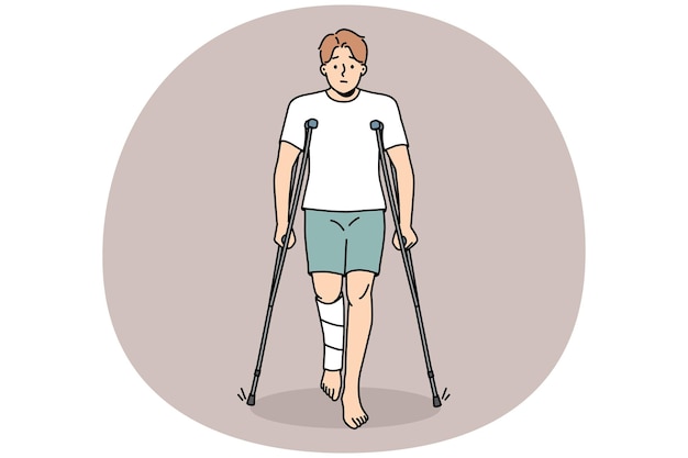 Young man with leg injury walk on crutches