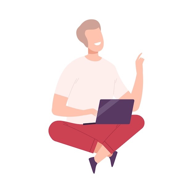 Young man with modern digital gadget guy sitting on the floor with crossed legs and communicating using his laptop flat vector illustration