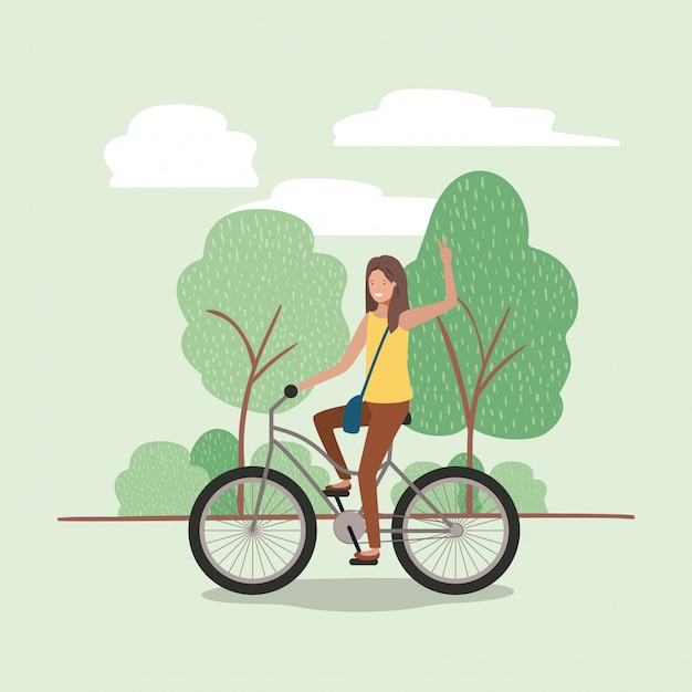 自転車で公園にいる若い女性