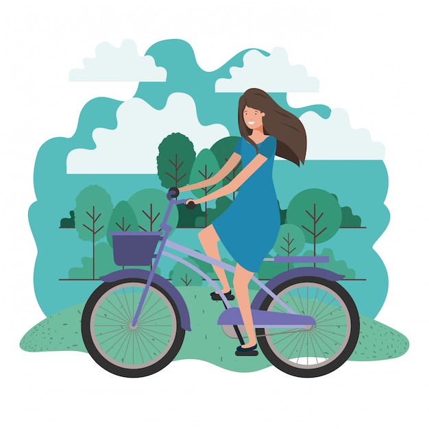 Giovane donna in bicicletta sul parco