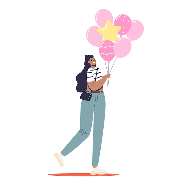 Young woman holding pink balloons