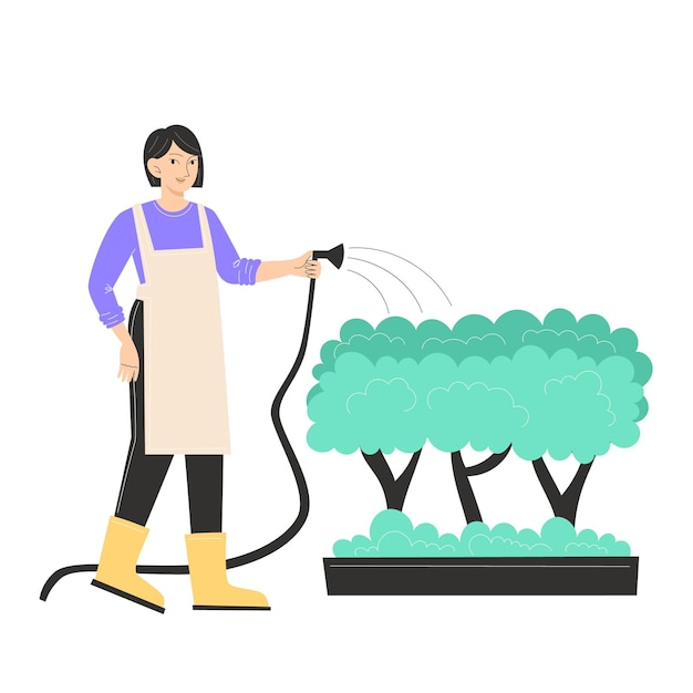 A young woman is watering the bushes in the garden