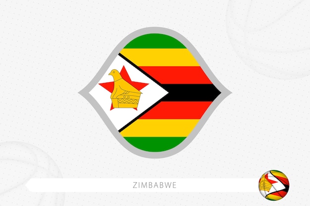 灰色のバスケットボールの背景にバスケットボールの競争のためのジンバブエの旗。