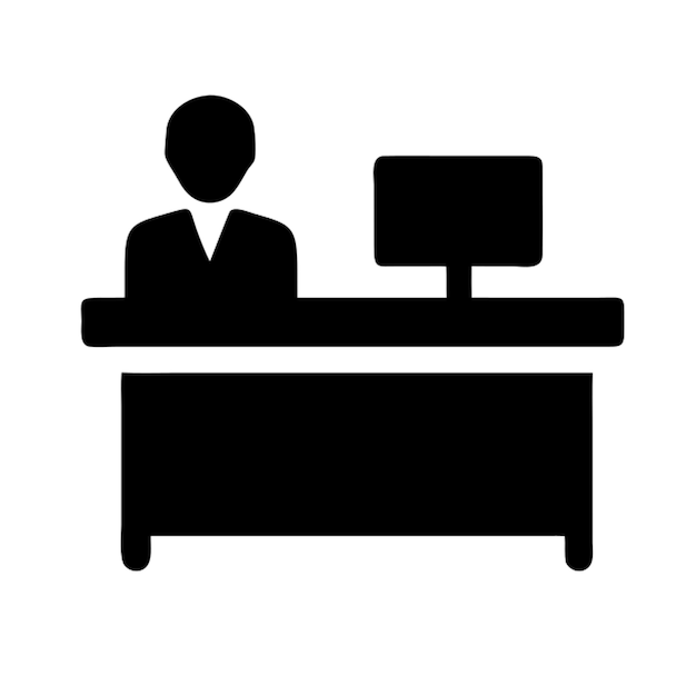 a man is sitting at a desk in front of a computer monitor