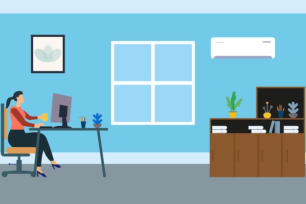 A woman sits in an office with a desk and a air conditioner on the wall.