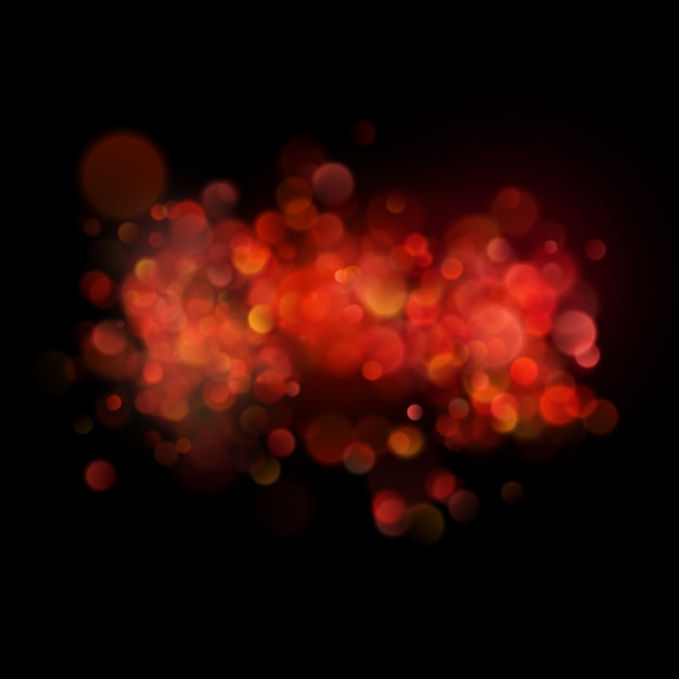 Abstract defocused circular red bokeh on dark background.