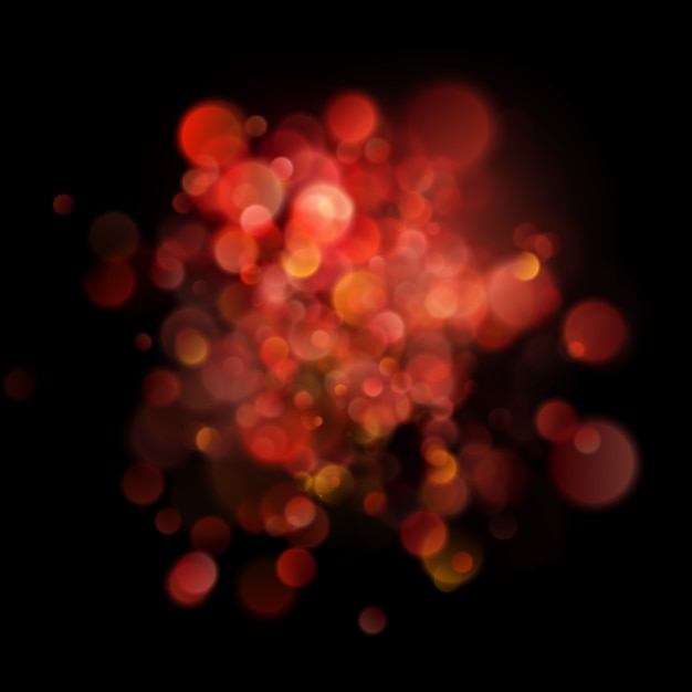 Abstract defocused circular red bokeh on dark background.