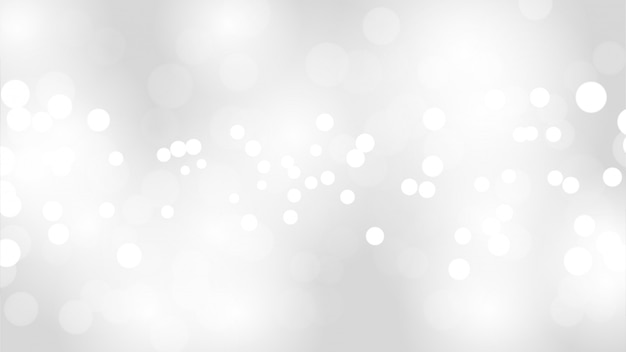 Abstrakt suddig vit och grå färgbakgrund med vita bokeh-ljus defokuserade.