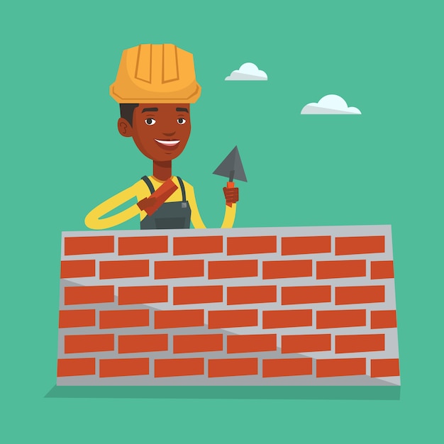Bricklayer working with spatula and brick.