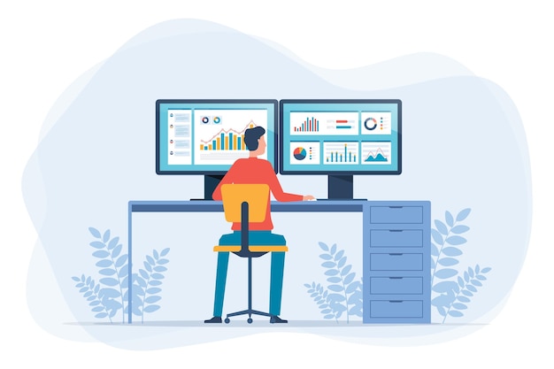 businessman sitting at a desk and analyzing data on two large computer monitors