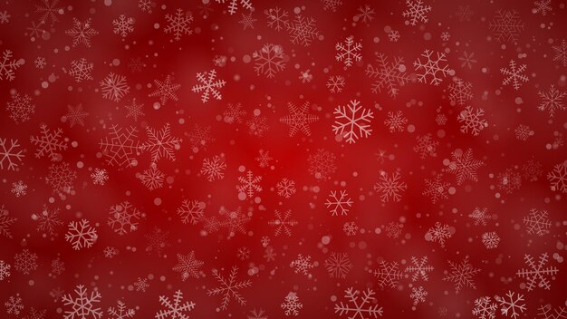 Christmas background of snowflakes of different shapes sizes and transparency in red colors