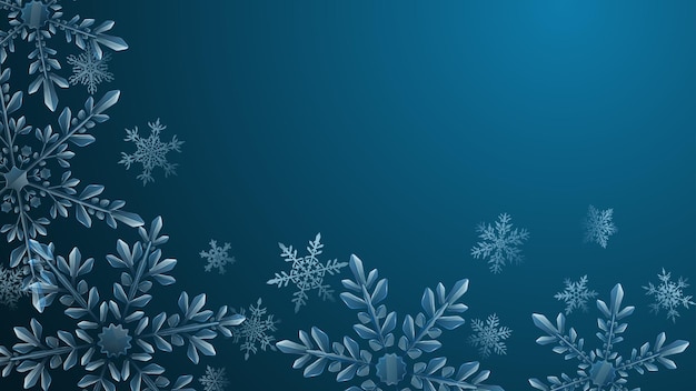 Christmas composition of large complex transparent snowflakes in light blue colors on dark gradient background