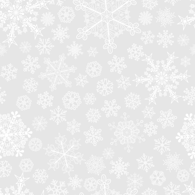 Christmas seamless pattern of big and small snowflakes white on gray