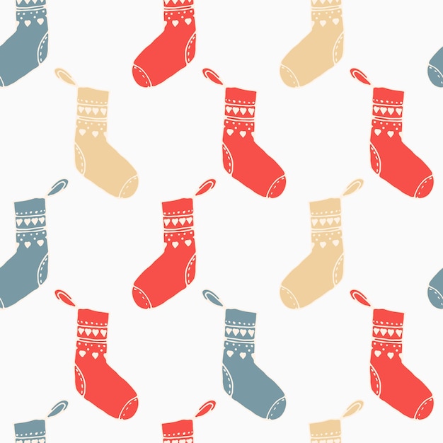 Christmas seamless pattern with socks over the fireplace. Bright merry christmas print red and blue