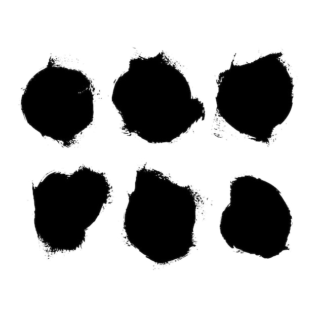 collection of six black brush stroke marks on a white surface