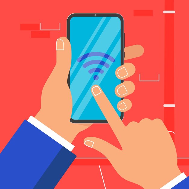 Hand holding black mobile phone isolated on blue background