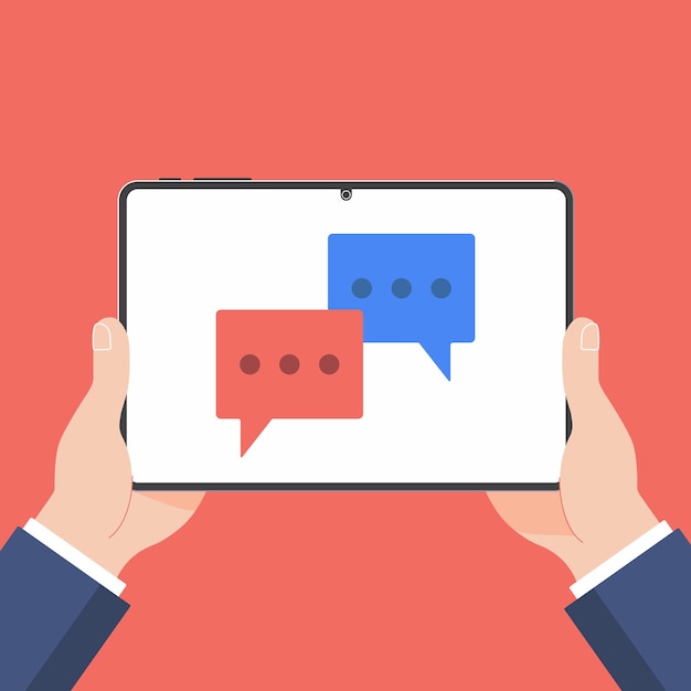 hand holding black tablet with chat bubbles isolated on background
