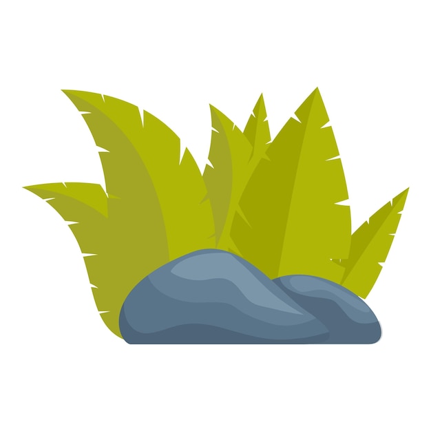 Lush green tropical leaves growing behind grey stones
