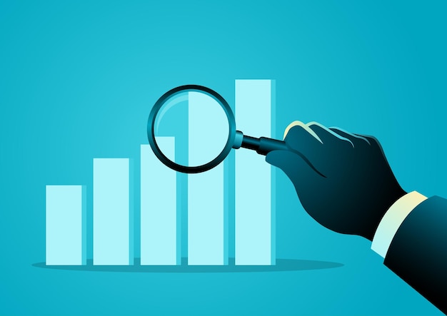 Man examines a graph chart with a magnifying glass