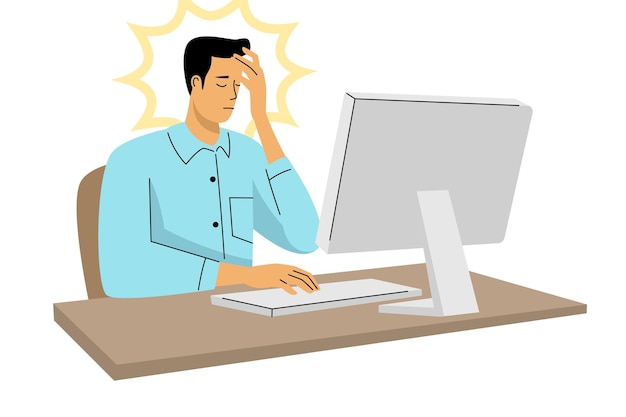 Man experiencing stress and headache while working on computer