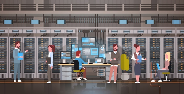 People Working In Data Center Room Hosting Server