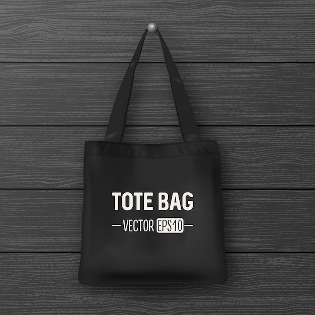 realistic vector black empty textile tote bag. closeup on wood background. design template for branding, mockup. eps10 illustration.