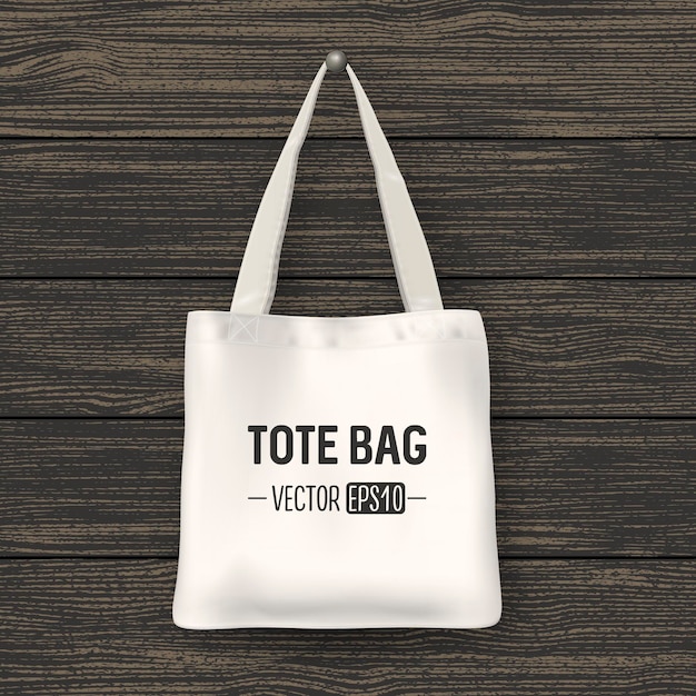 realistic vector white textile tote bag. closeup on wood background. design template for branding, mockup. eps10 illustration.