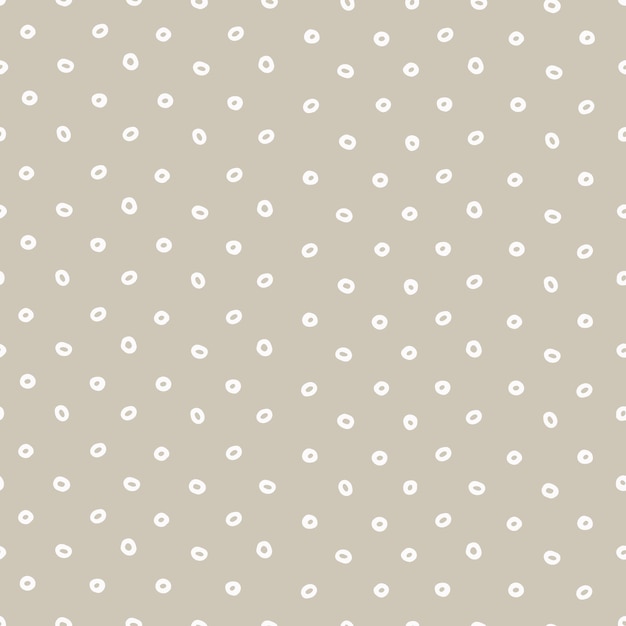 Seamless geometric pattern with hand drawn uneven white rings on beige background for surface design craft apparel and other design projects