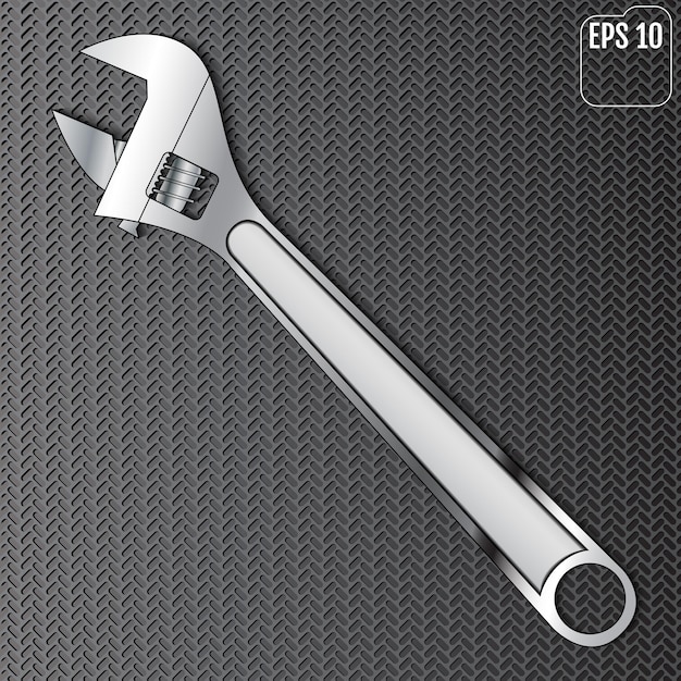Wrench in front of a black carbon wall