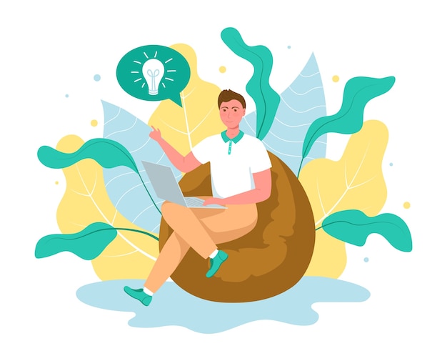 Cute young man sitting on comfy frameless chair with laptop computer. Concept male working freelance.