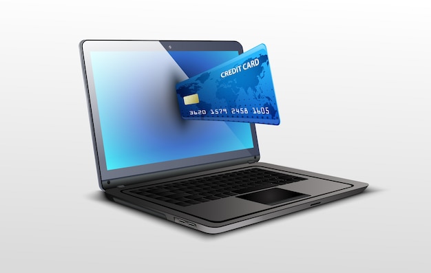 laptop and credit card on white isolated background
